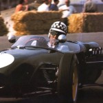 With tradmark chequred helmet